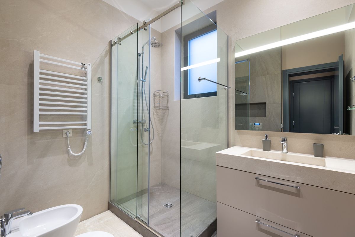 Newly remodeled bathroom with glass shower enclosure